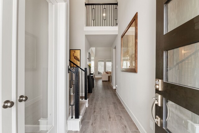 1918 Longcroft Ln, Katy, TX 77493 - foyer entrance featuring a towering ceiling, baseboards, wood finished floors, and stairway