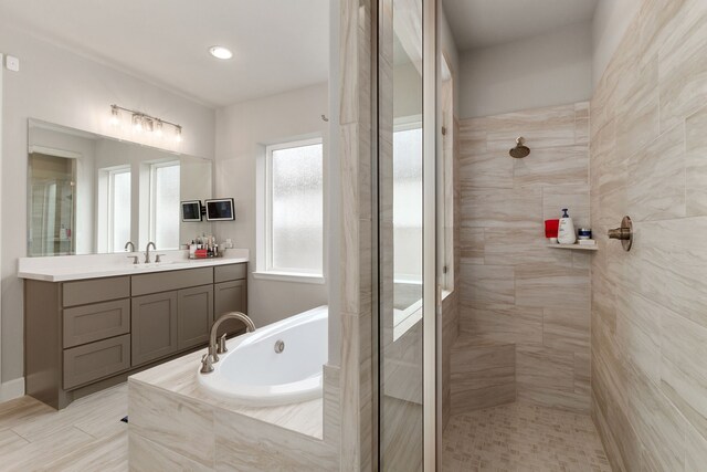 1918 Longcroft Ln, Katy, TX 77493 - bathroom featuring tiled shower, a garden tub, and vanity