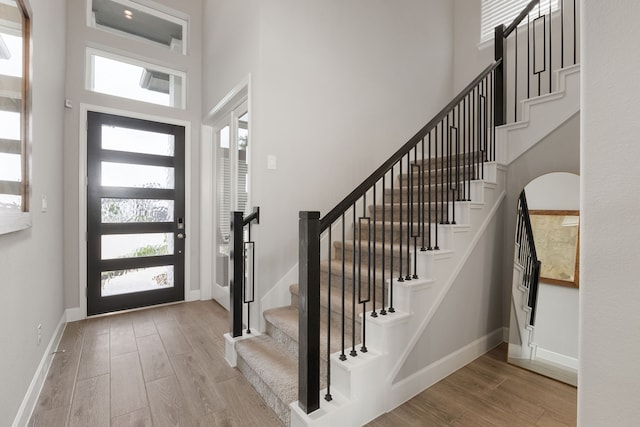 1918 Longcroft Ln, Katy, TX 77493 - foyer with a high ceiling, healthy amount of natural light, stairs, wood finished floors, and baseboards