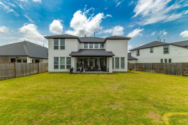 1918 Longcroft Ln, Katy, TX 77493 - back of property featuring ceiling fan, a patio, stucco siding, and roof with shingles