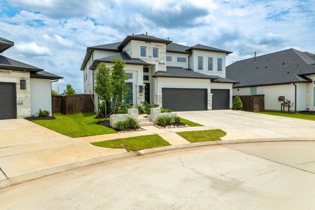 1918 Longcroft Ln, Katy, TX 77493 - prairie-style house with stone siding, driveway, a garage, and stucco siding