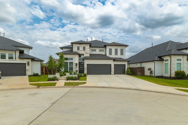 1918 Longcroft Ln, Katy, TX 77493 - prairie-style house with an attached garage, concrete driveway, stone siding, stucco siding, and roof with shingles