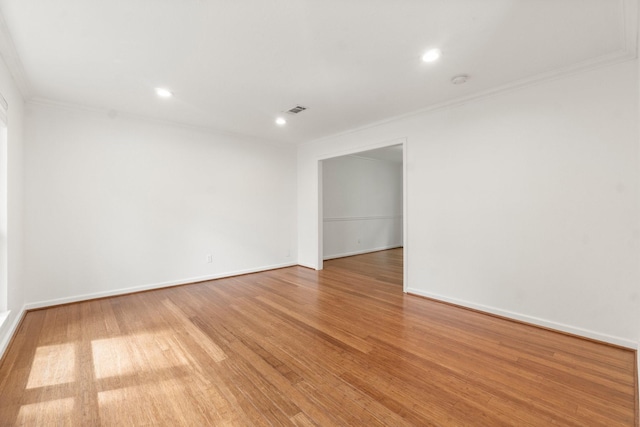 28 Silver Elm Pl, The Woodlands, TX 77381 - unfurnished room featuring ornamental molding, wood finished floors, baseboards, and recessed lighting