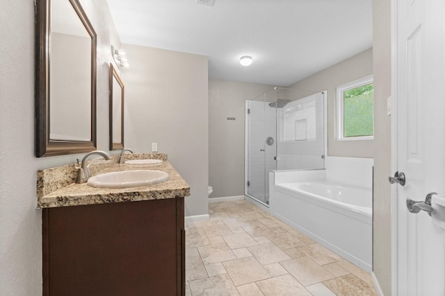 28 Silver Elm Pl, The Woodlands, TX 77381 - full bathroom with double vanity, a stall shower, a bath, toilet, and baseboards