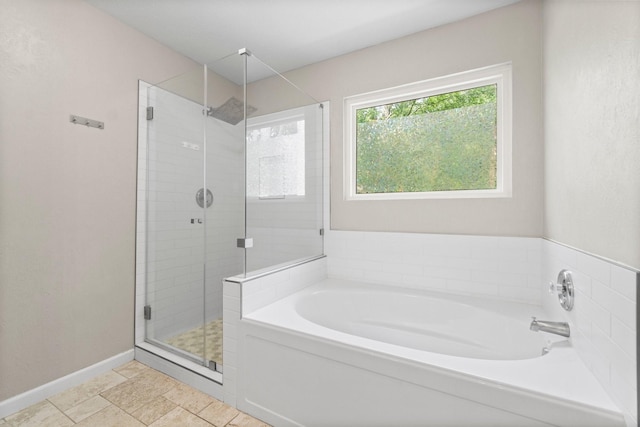 28 Silver Elm Pl, The Woodlands, TX 77381 - full bath featuring a bath, a shower stall, and baseboards