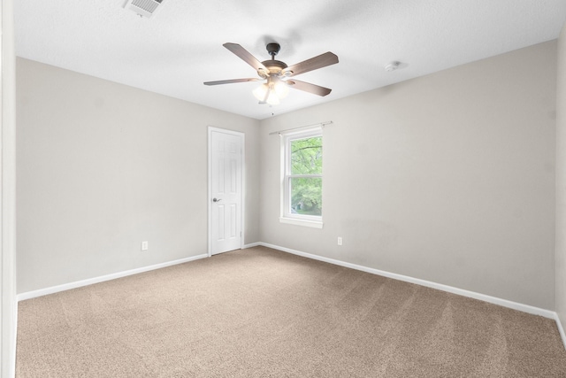 28 Silver Elm Pl, The Woodlands, TX 77381 - spare room featuring carpet, baseboards, ceiling fan, and a smoke detector
