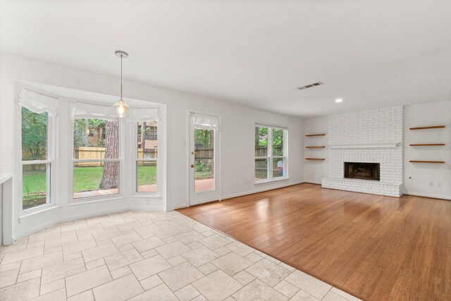 28 Silver Elm Pl, The Woodlands, TX 77381 - unfurnished living room with a fireplace, wood finished floors, baseboards, and recessed lighting