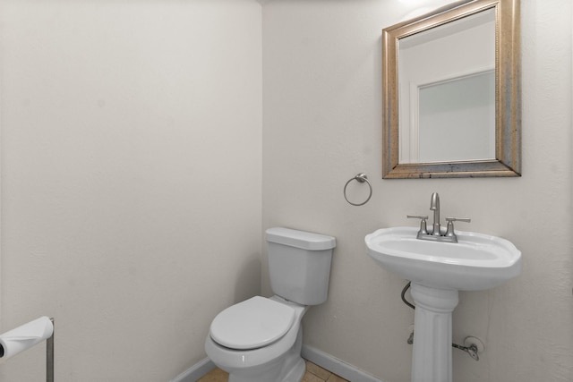 28 Silver Elm Pl, The Woodlands, TX 77381 - bathroom featuring toilet and baseboards