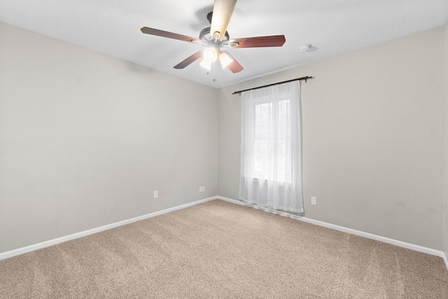 28 Silver Elm Pl, The Woodlands, TX 77381 - unfurnished room with light colored carpet, baseboards, and a ceiling fan