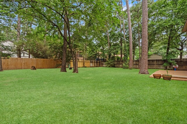 28 Silver Elm Pl, The Woodlands, TX 77381 - view of yard featuring a wooden deck