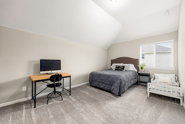 14121 N Lake Branch Ln, Houston, TX 77044 - carpeted bedroom with lofted ceiling, baseboards, and a desk