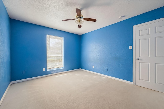 8100 Creekbend Dr Unit 146, Houston, TX 77071 - spare room featuring carpet flooring, ceiling fan, baseboards, and a textured ceiling