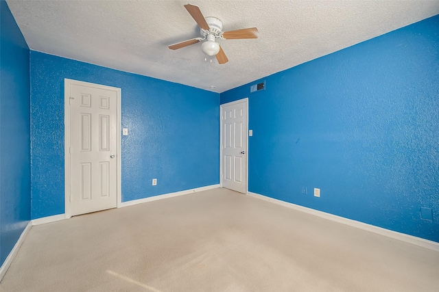 8100 Creekbend Dr Unit 146, Houston, TX 77071 - carpeted spare room featuring a textured ceiling, baseboards, a ceiling fan, and a textured wall
