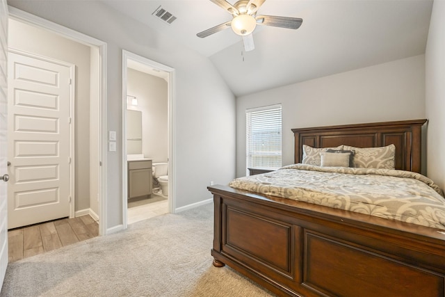 10522 Rigel Ridge Way, Richmond, TX 77406 - bedroom featuring light carpet, vaulted ceiling, baseboards, ensuite bath, and a ceiling fan