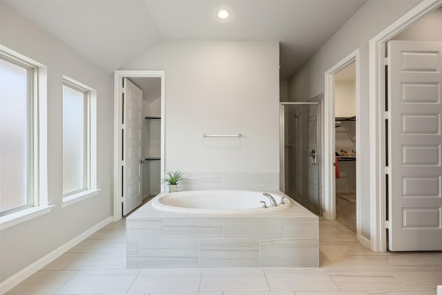 10522 Rigel Ridge Way, Richmond, TX 77406 - bathroom with a garden tub, a shower stall, a walk in closet, tile patterned flooring, and lofted ceiling