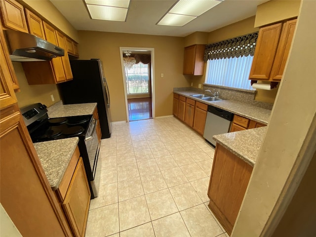 3306 High Pine Dr, Missouri City, TX 77459 - kitchen featuring under cabinet range hood, stainless steel appliances, brown cabinets, a sink, and light tile patterned flooring