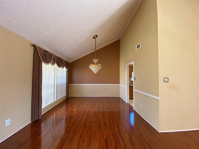 3306 High Pine Dr, Missouri City, TX 77459 - spare room featuring a chandelier, wood finished floors, ornamental molding, baseboards, and high vaulted ceiling