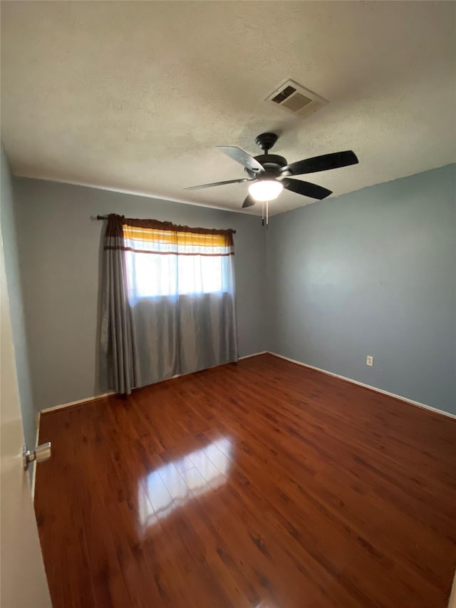 3306 High Pine Dr, Missouri City, TX 77459 - empty room featuring ceiling fan, wood finished floors, and a textured ceiling