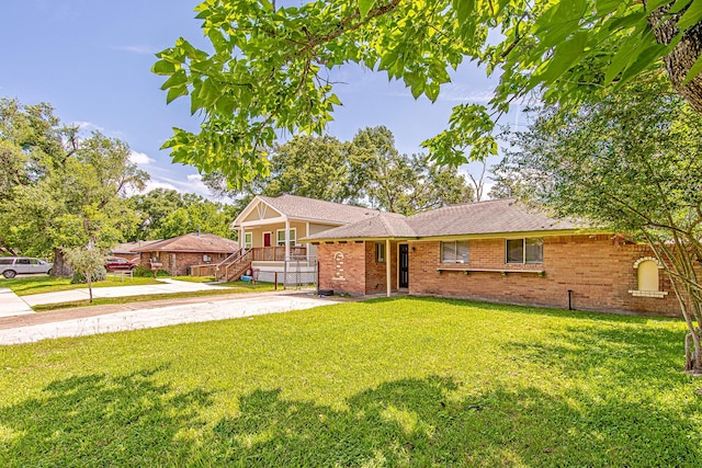 11058 Vailview Dr, Houston, TX 77016 - split level home featuring a front lawn and brick siding