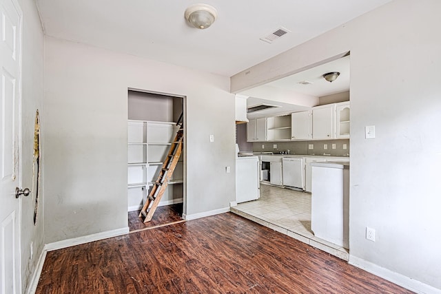 1006 Fruitvale Dr, Houston, TX 77038 - unfurnished dining area featuring light wood-type flooring, baseboards, and a sink