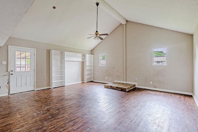 1006 Fruitvale Dr, Houston, TX 77038 - unfurnished living room featuring wood finished floors, beam ceiling, ceiling fan, baseboards, and high vaulted ceiling