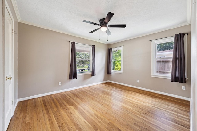 7658 El Rancho St, Houston, TX 77087 - unfurnished room featuring light wood-style floors, crown molding, a textured ceiling, baseboards, and a ceiling fan