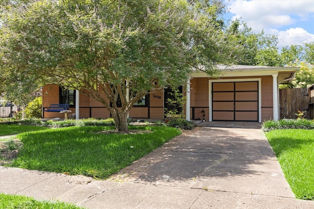 7658 El Rancho St, Houston, TX 77087 - obstructed view of property featuring concrete driveway