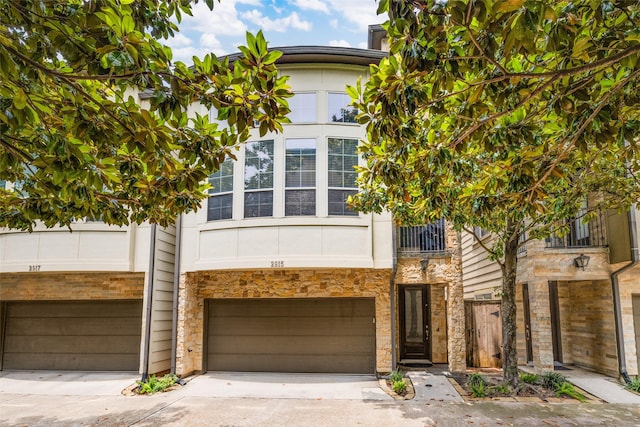 2915 Pease St, Houston, TX 77003 - multi unit property featuring stone siding, driveway, and a garage