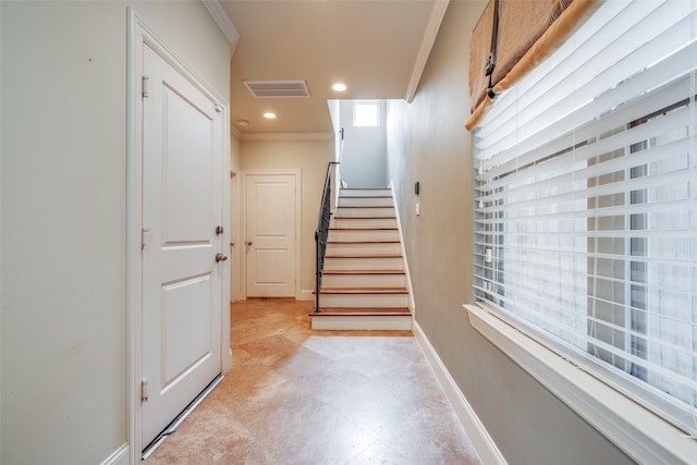 2915 Pease St, Houston, TX 77003 - stairway featuring crown molding, baseboards, and recessed lighting