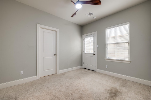 2915 Pease St, Houston, TX 77003 - empty room with a ceiling fan, light carpet, and baseboards