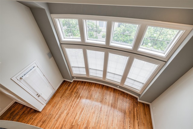 2915 Pease St, Houston, TX 77003 - unfurnished living room with baseboards and wood finished floors