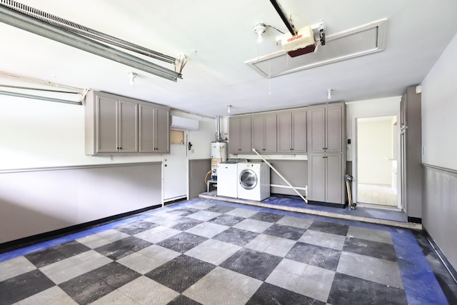 5010 Redstart St, Houston, TX 77035 - garage featuring a garage door opener, gas water heater, and independent washer and dryer