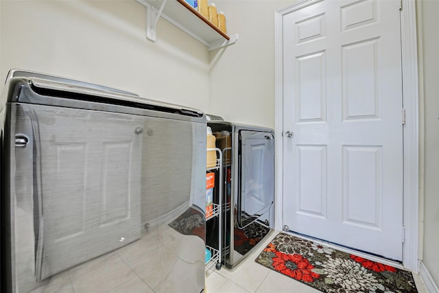 4114 Elk Bluff Ln, Katy, TX 77494 - laundry area featuring independent washer and dryer and tile patterned flooring