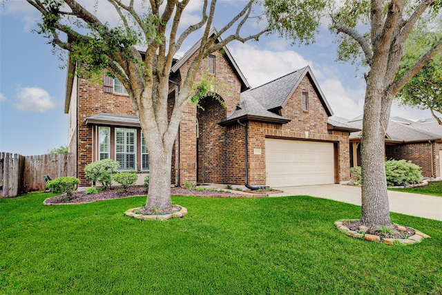 4114 Elk Bluff Ln, Katy, TX 77494 - view of front facade with brick siding, concrete driveway, an attached garage, and roof with shingles