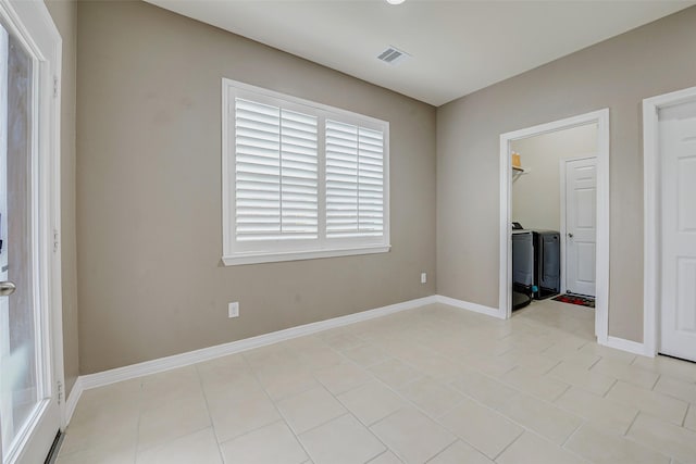 4114 Elk Bluff Ln, Katy, TX 77494 - empty room featuring baseboards and washing machine and dryer