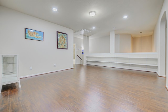 4114 Elk Bluff Ln, Katy, TX 77494 - unfurnished living room featuring attic access, wood finished floors, recessed lighting, and baseboards