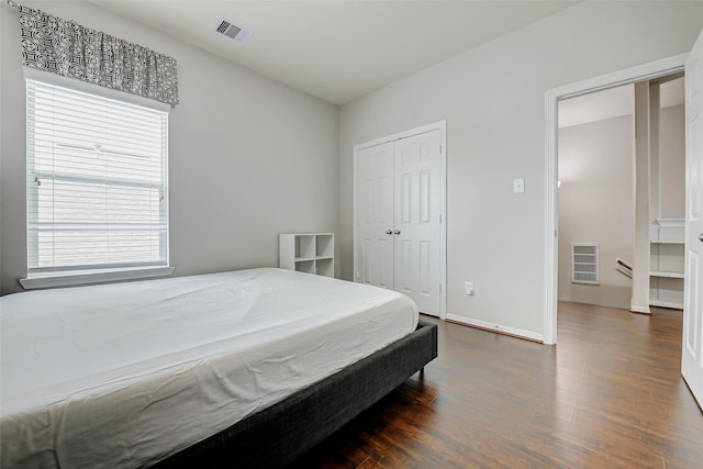 4114 Elk Bluff Ln, Katy, TX 77494 - bedroom with dark wood finished floors, baseboards, and a closet