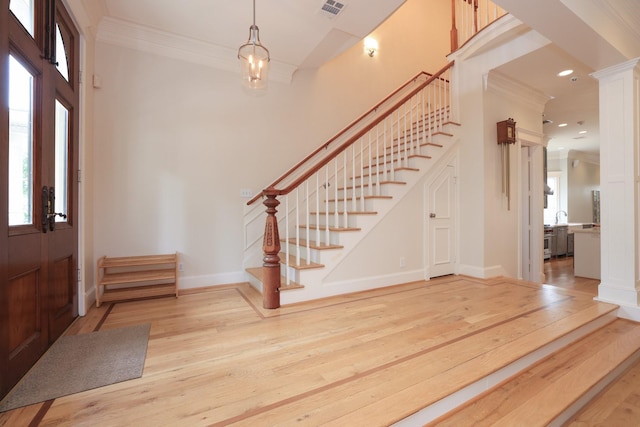 1132 Oxford St, Houston, TX 77008 - entryway with stairway, wood-type flooring, crown molding, healthy amount of natural light, and recessed lighting