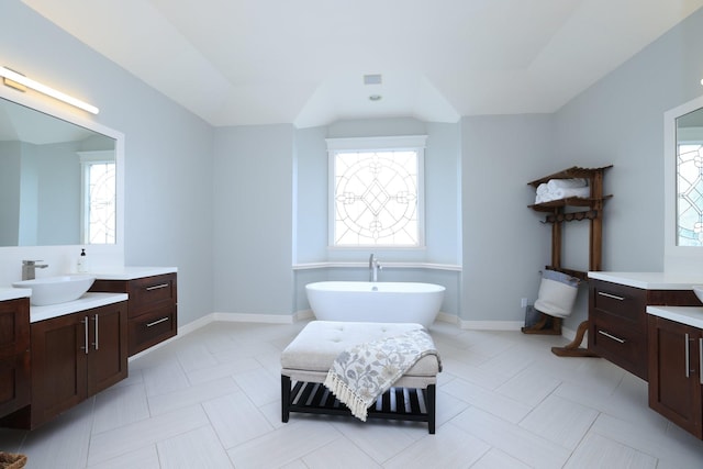 1132 Oxford St, Houston, TX 77008 - full bathroom with a freestanding tub, vanity, and baseboards