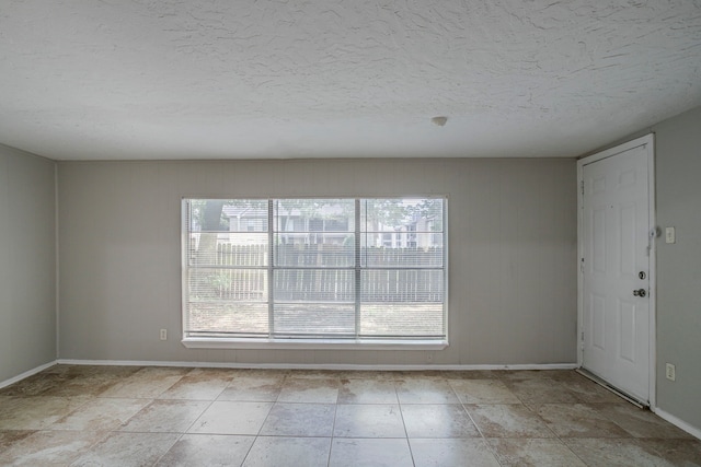5902 Yorkgate Dr, Spring, TX 77373 - empty room with a textured ceiling and baseboards