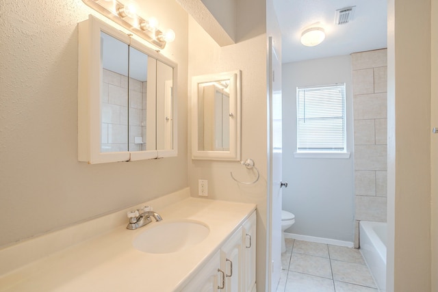 5902 Yorkgate Dr, Spring, TX 77373 - bathroom with vanity, toilet, and tile patterned flooring