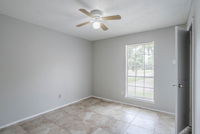 5902 Yorkgate Dr, Spring, TX 77373 - unfurnished room with ceiling fan, baseboards, and light tile patterned floors