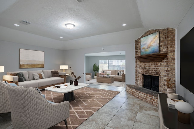 5902 Yorkgate Dr, Spring, TX 77373 - tiled living area with a textured ceiling, a fireplace, and lofted ceiling