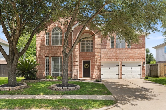 3901 Kimberly Dr, Pearland, TX 77581 - view of front of home featuring concrete driveway, an attached garage, and brick siding