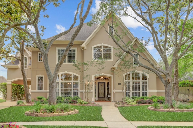 3807 Snead Ct, Sugar Land, TX 77479 - view of front of home with stucco siding and a front yard