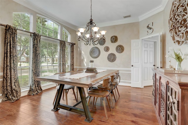 3807 Snead Ct, Sugar Land, TX 77479 - dining area featuring ornamental molding, a chandelier, and wood finished floors