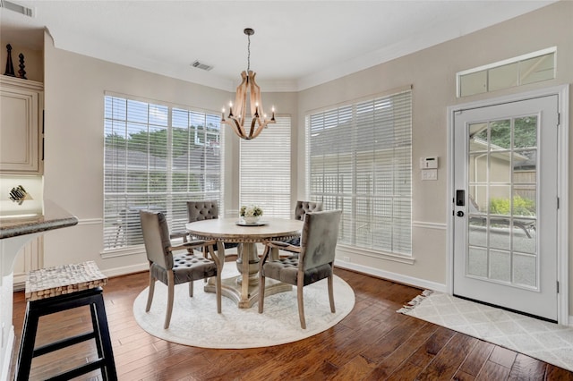 3807 Snead Ct, Sugar Land, TX 77479 - dining space featuring a chandelier, dark wood finished floors, and baseboards