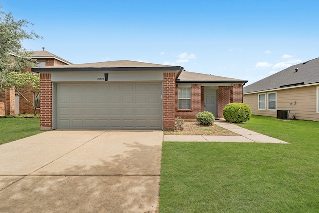21606 Borah Peak Way, Katy, TX 77449 - ranch-style house featuring brick siding, driveway, central air condition unit, a garage, and a front lawn