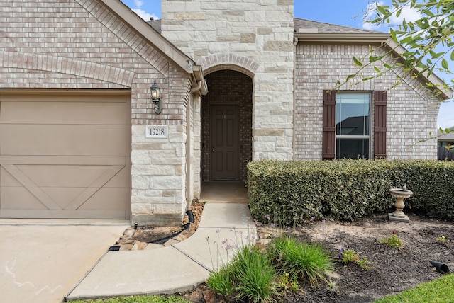 19218 Charisma Rose Ln, Tomball, TX 77377 - entrance to property featuring brick siding, driveway, a shingled roof, and a garage