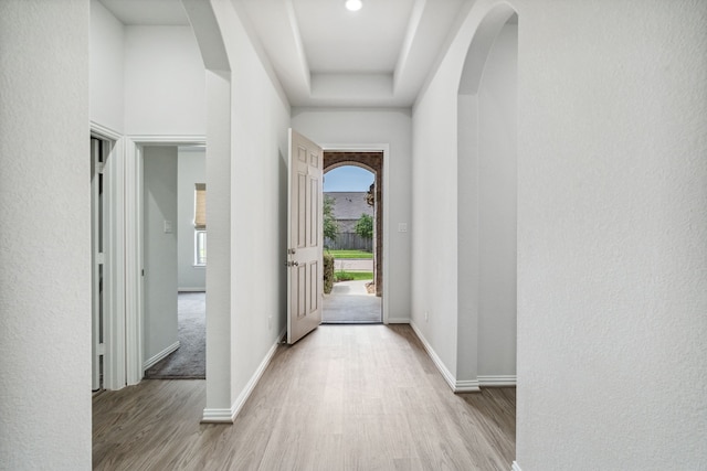 19218 Charisma Rose Ln, Tomball, TX 77377 - hallway with wood finished floors, arched walkways, and baseboards